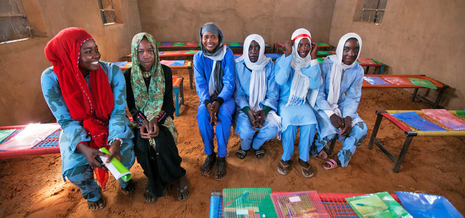 22 June 2014. El Fasher: Students attend the opening ceremony of two new classrooms for a secondary school for displaced girls at Zam Zam camp, North Darfur. The construction took three months to complete and was sponsored by the UNAMID Turkish police contingent. Photo by Albert Gonz‡lez Farran, UNAMID.