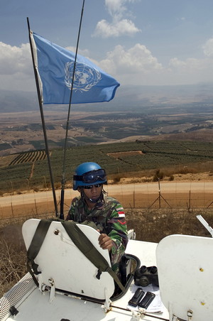 UNIFIL Indonesian UNIFIL peacekeeper atop armoured personnel carrier next to the Israeli "Technical Fence" along the Blue Line at Kafer Kila, South Lebanon. 28 August 2009. Pasqual GORRIZ/UNIFIL